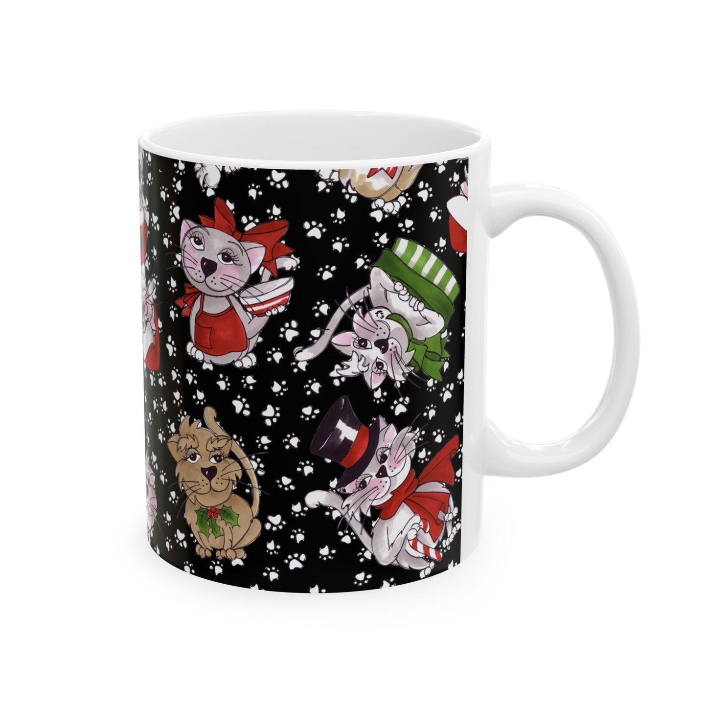 White mug with a black background featuring festive cartoon cats and white paw prints.