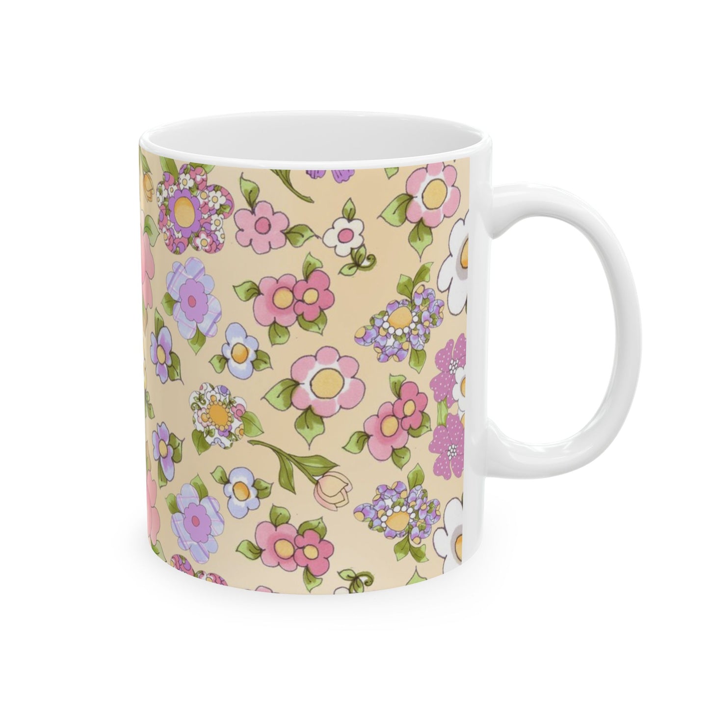 White mug with colorful floral patterns in pink, purple, and yellow on a beige background.