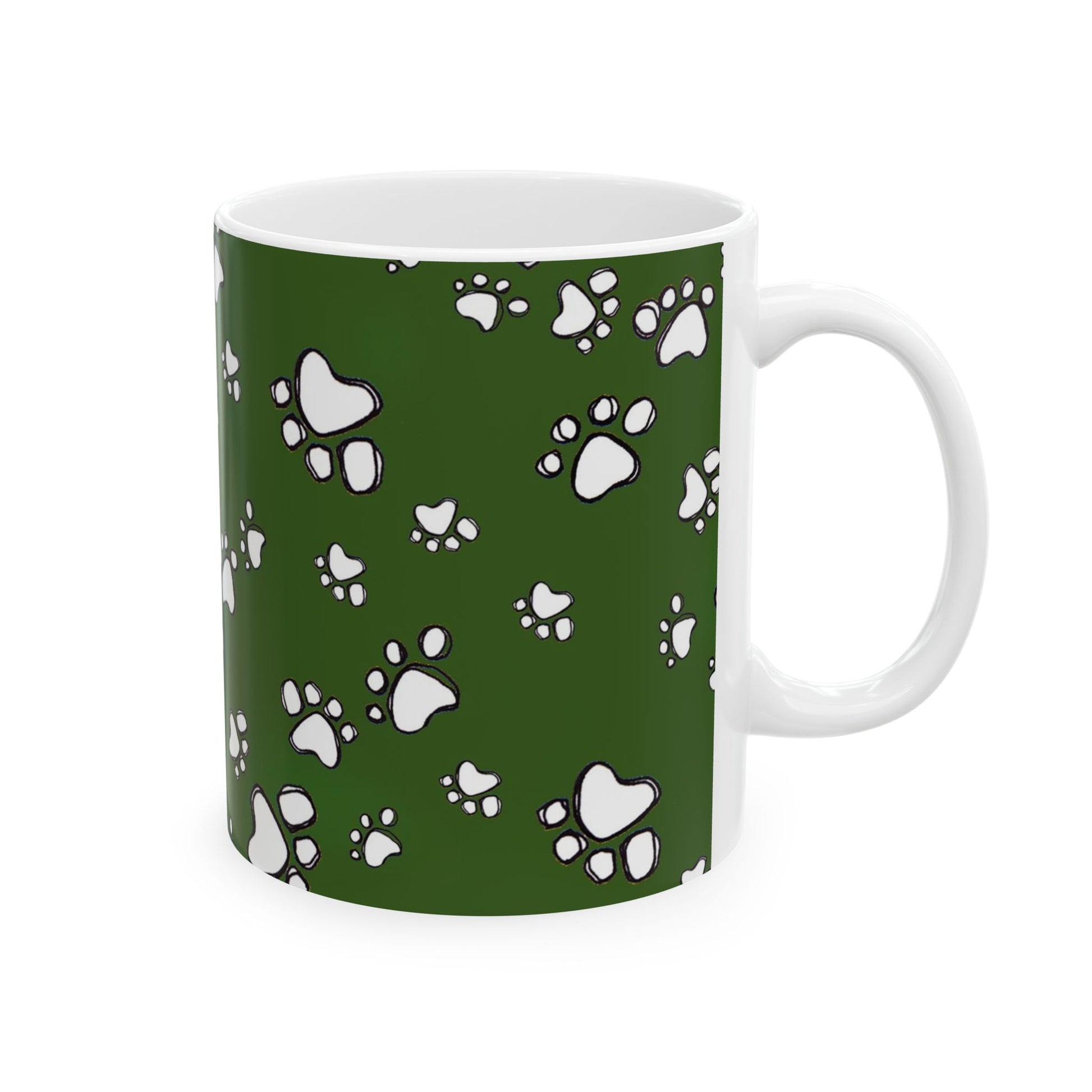 White mug with green background and white paw print pattern.