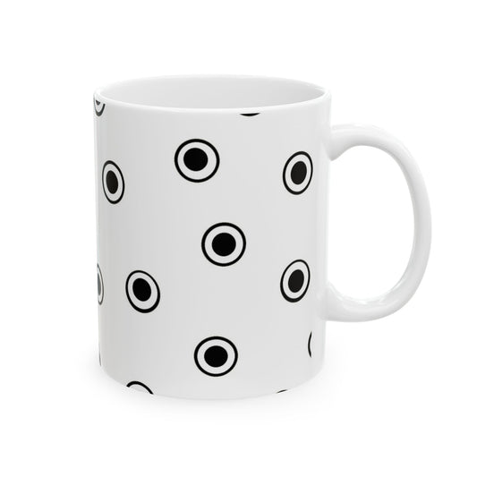 White mug with black concentric circle pattern; simple and modern design.