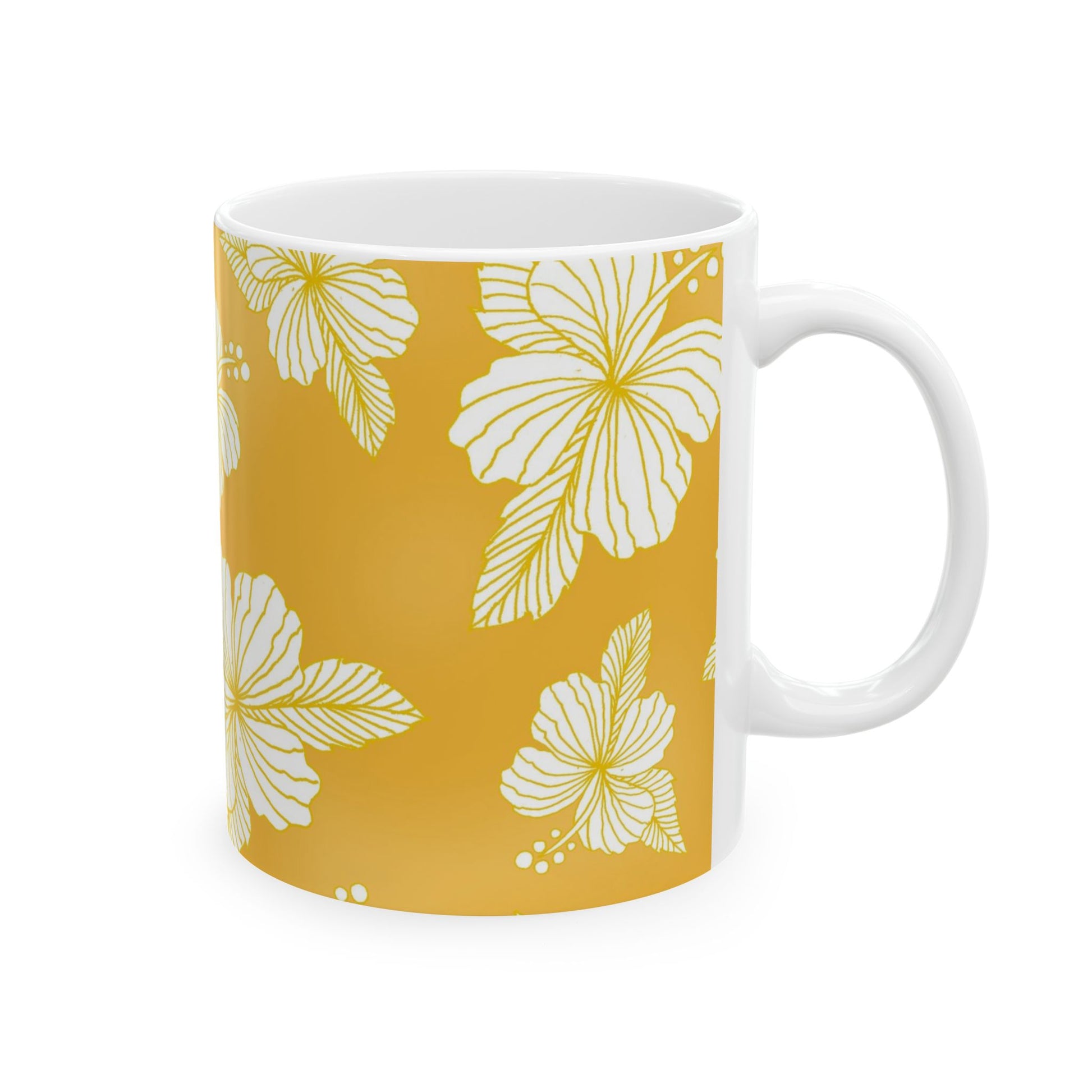 White mug with yellow floral pattern featuring large, detailed hibiscus flowers.
