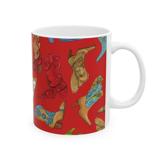White mug with colorful cowboy boots on a red background.