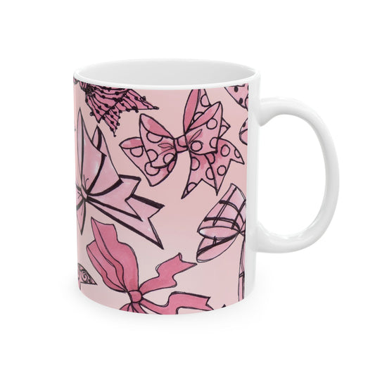 White mug with pink bow patterns and black outlines on a light pink background.