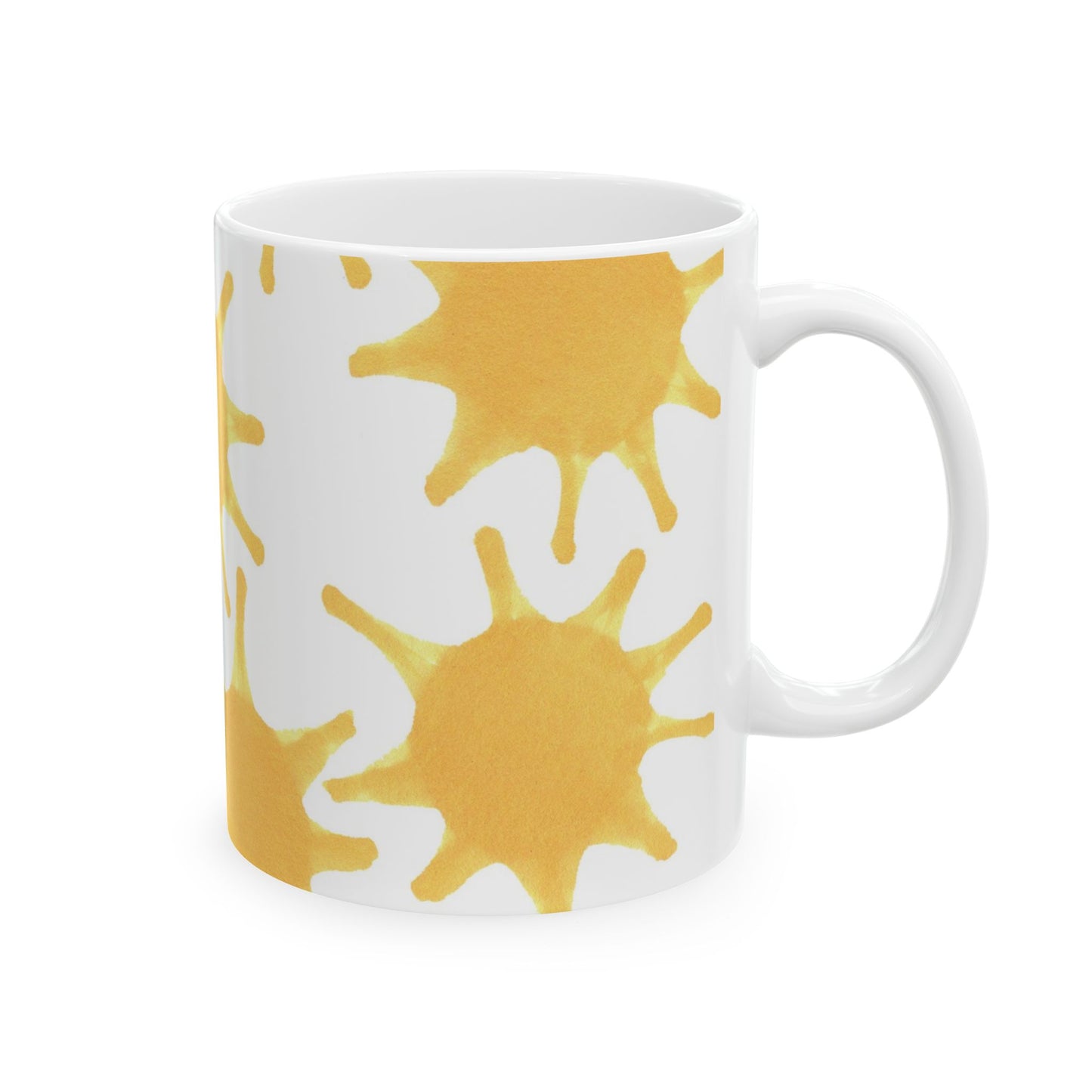 White mug with yellow sunburst patterns on the side.
