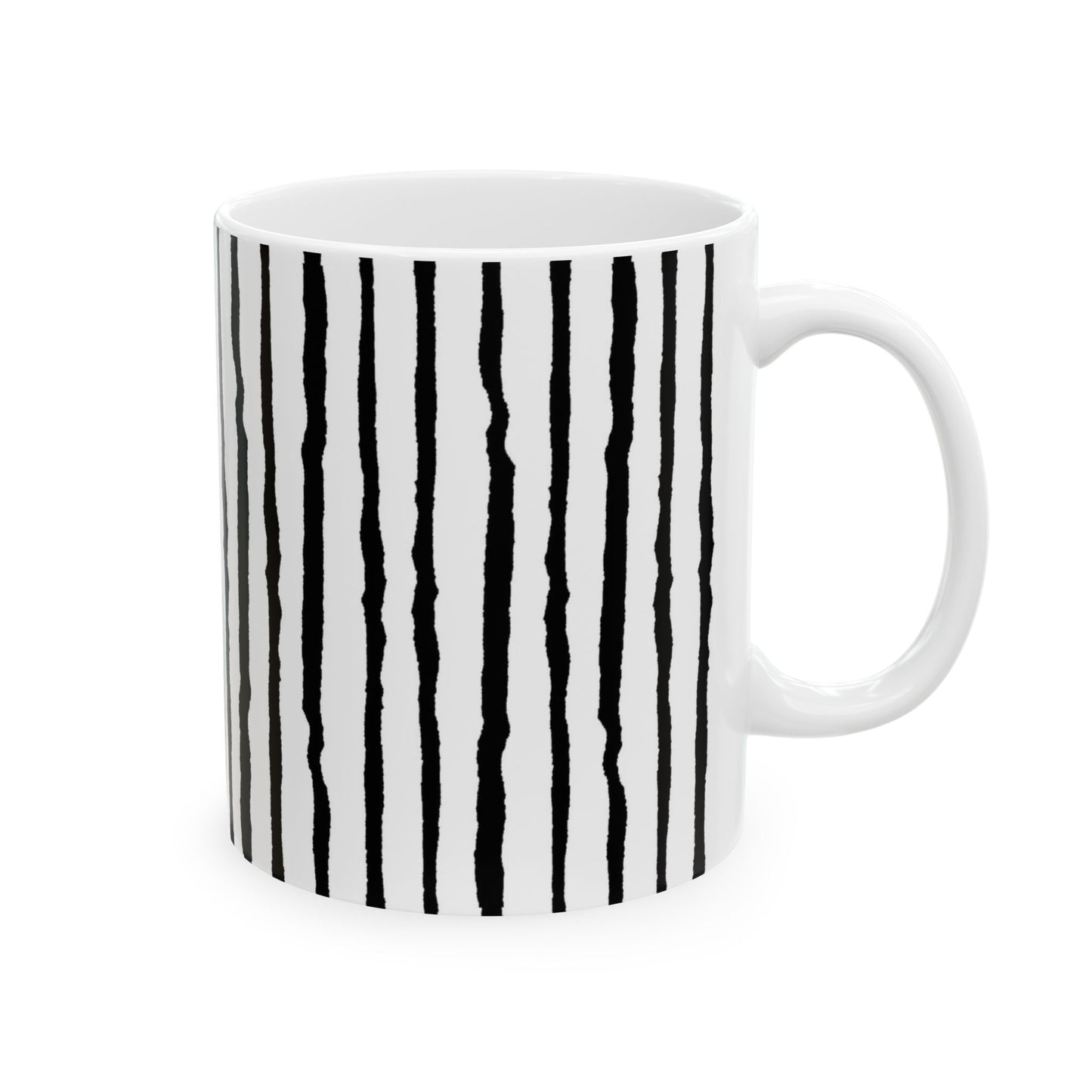 White mug with irregular black vertical stripes and a white handle.