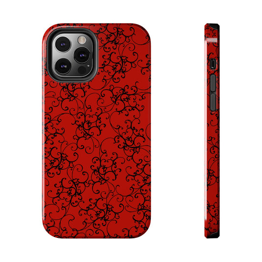 Red phone case with black intricate swirl pattern and visible camera cutout. Side buttons shown.