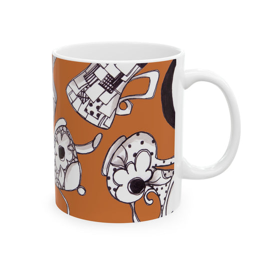 White mug with black floral and geometric designs on an orange background.