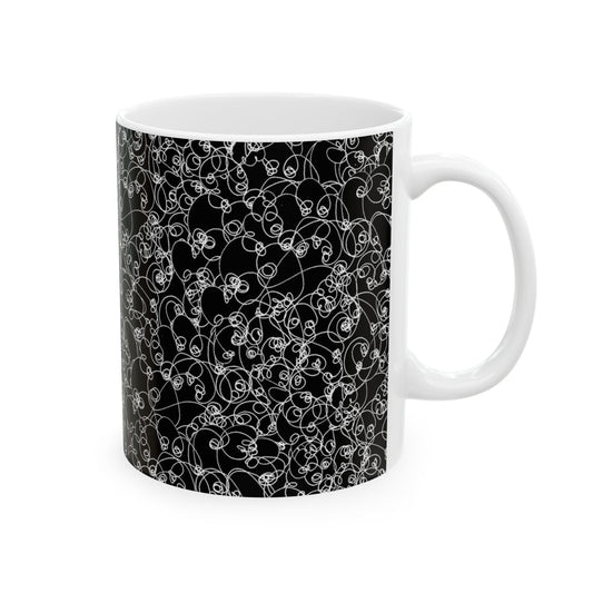 White mug with intricate black and white swirly pattern covering its surface.