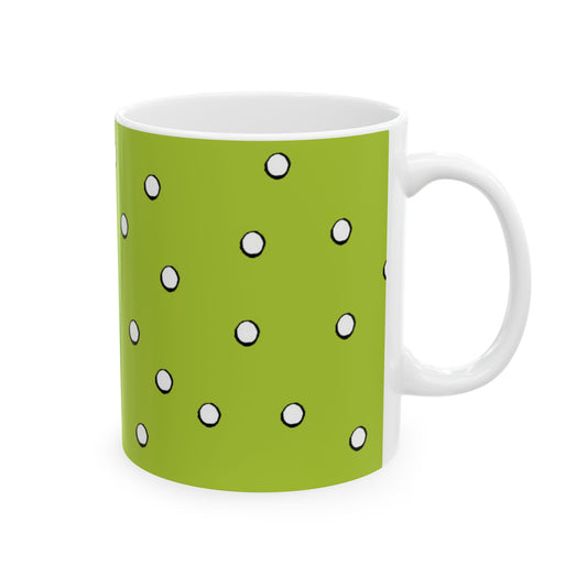 Green mug with white polka dots pattern, white handle, and interior.