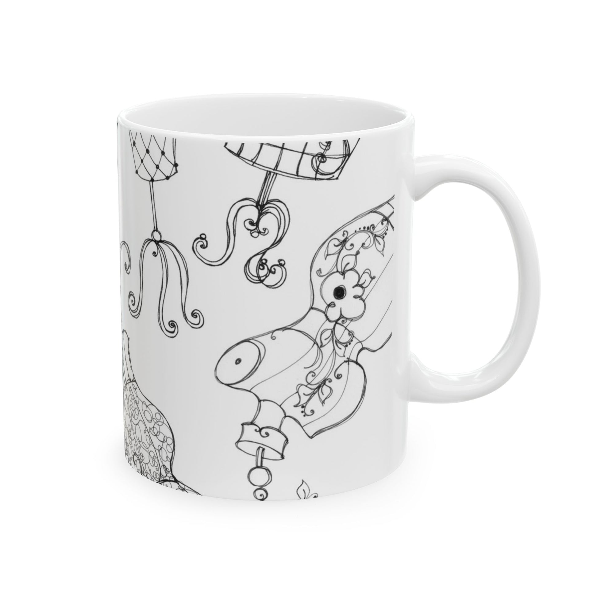 White mug with intricate black line drawings of floral and abstract designs.