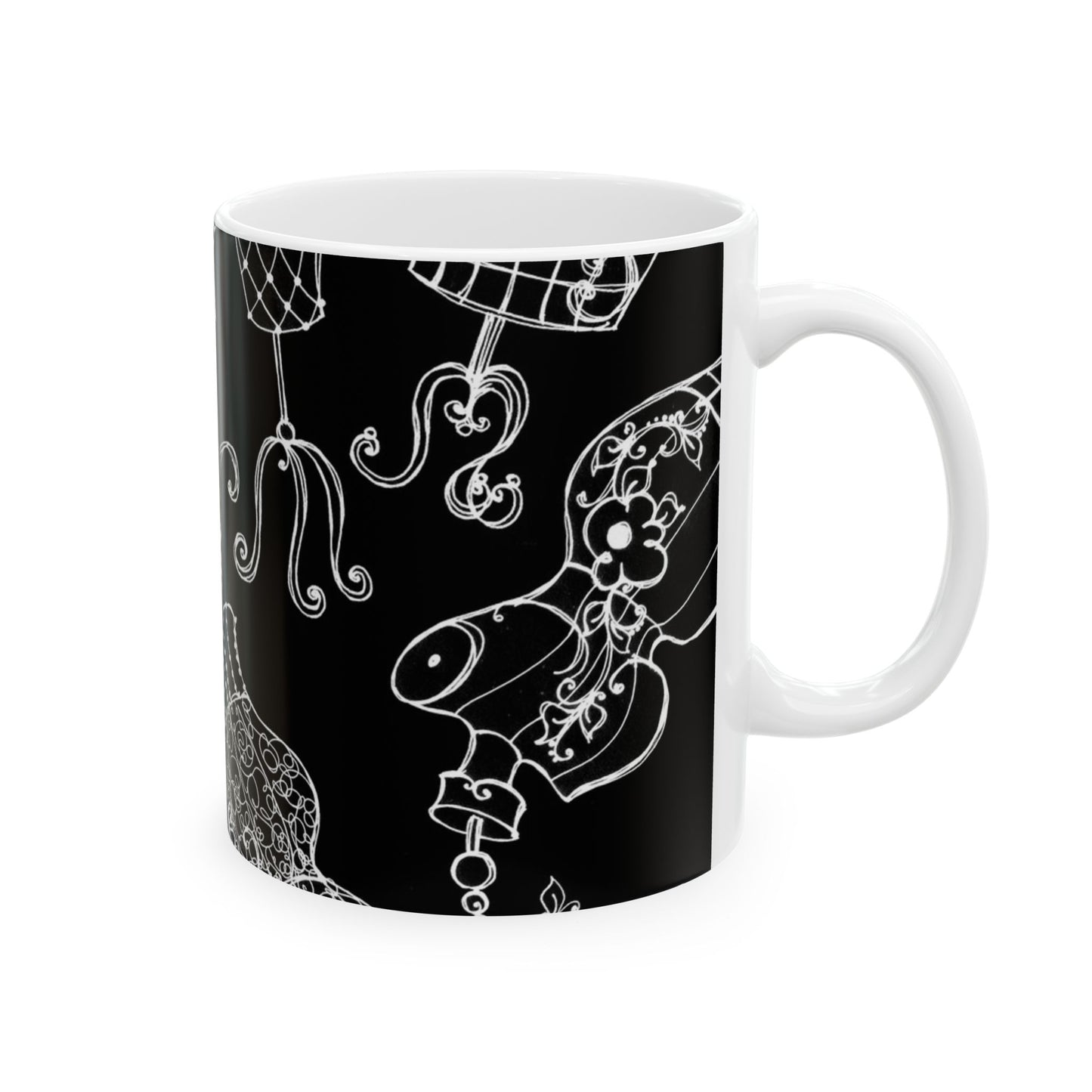 White mug with intricate white floral and abstract designs on a black background.