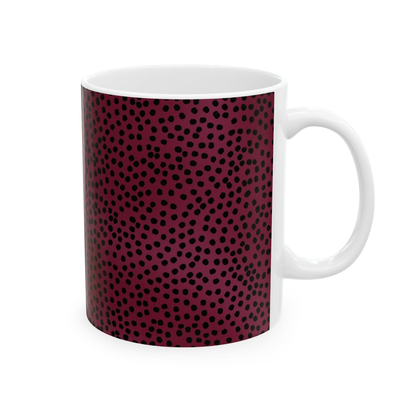 White mug with a dark red and black polka dot pattern covering the sides.