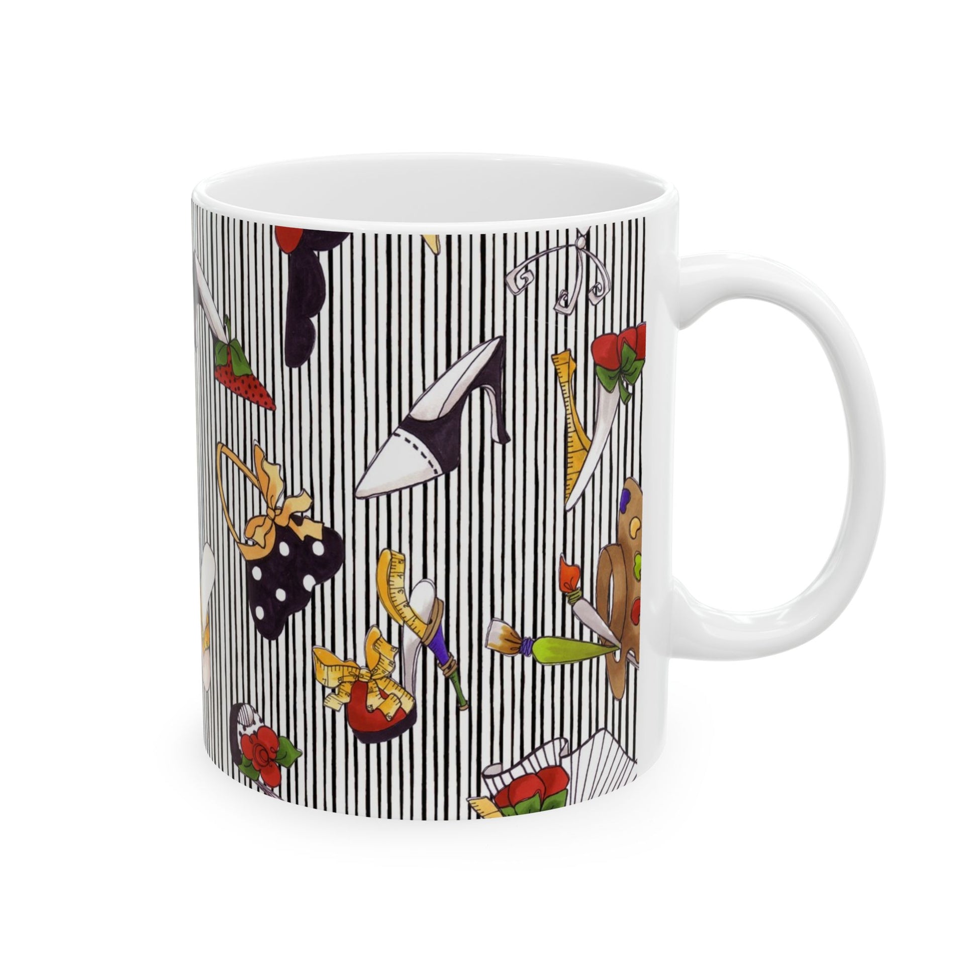 White mug with black stripes, featuring colorful shoes, bags, and art supplies scattered.