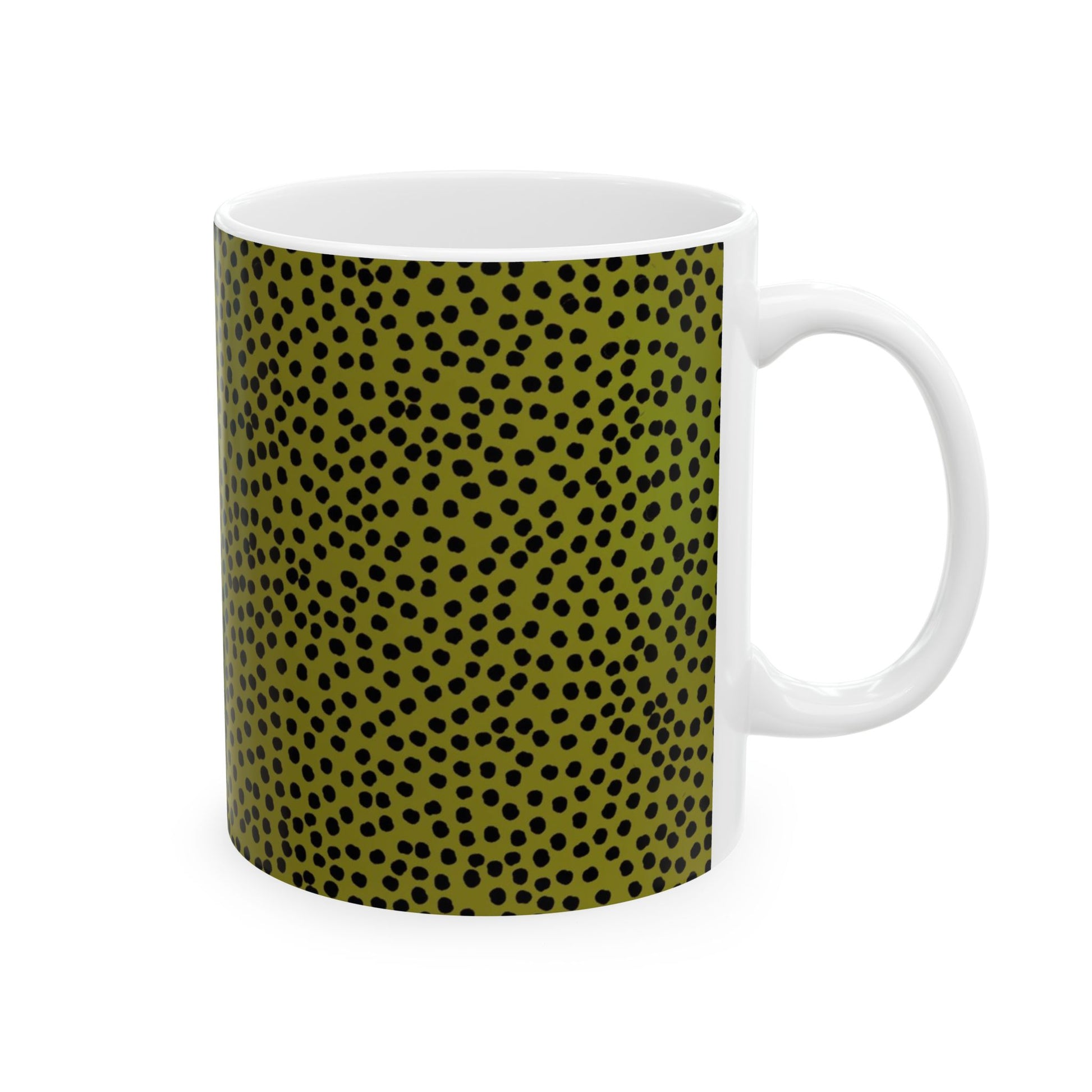 White mug with olive green and black polka dot pattern covering the surface.