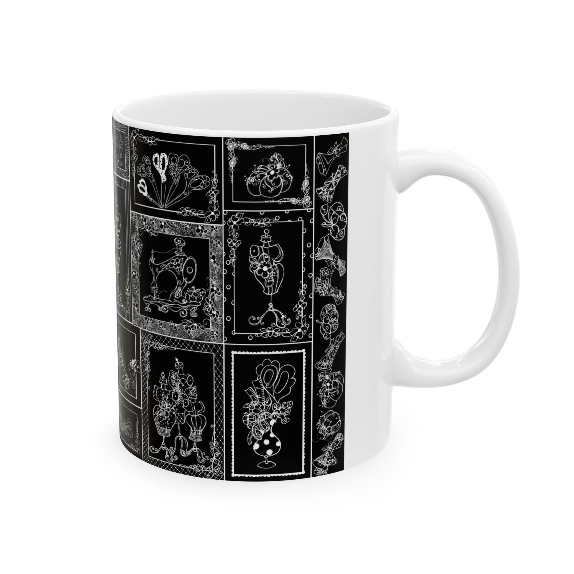 White mug with intricate black and white floral and vintage sewing-themed designs.
