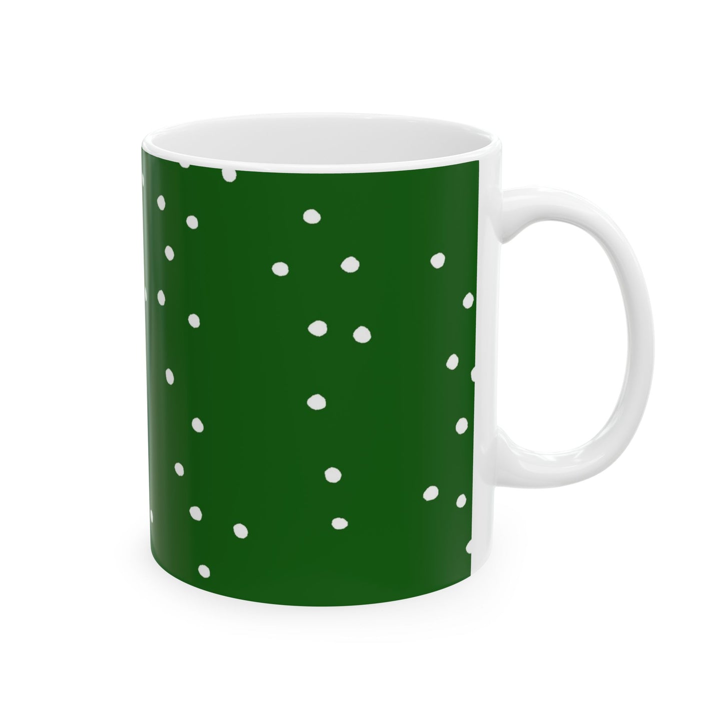 White mug with a dark green background and scattered white polka dots.