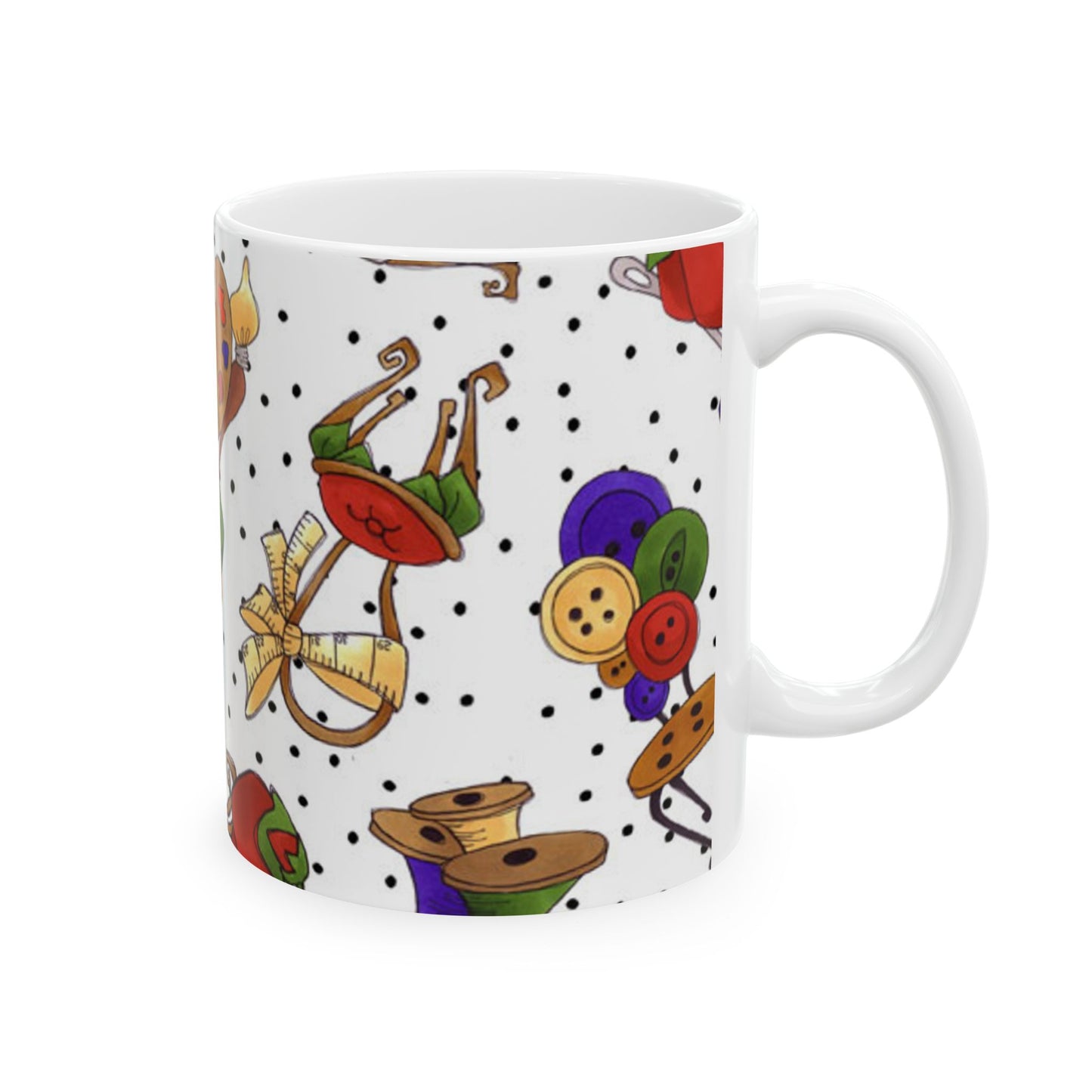 White mug with colorful sewing-themed patterns and black polka dots.