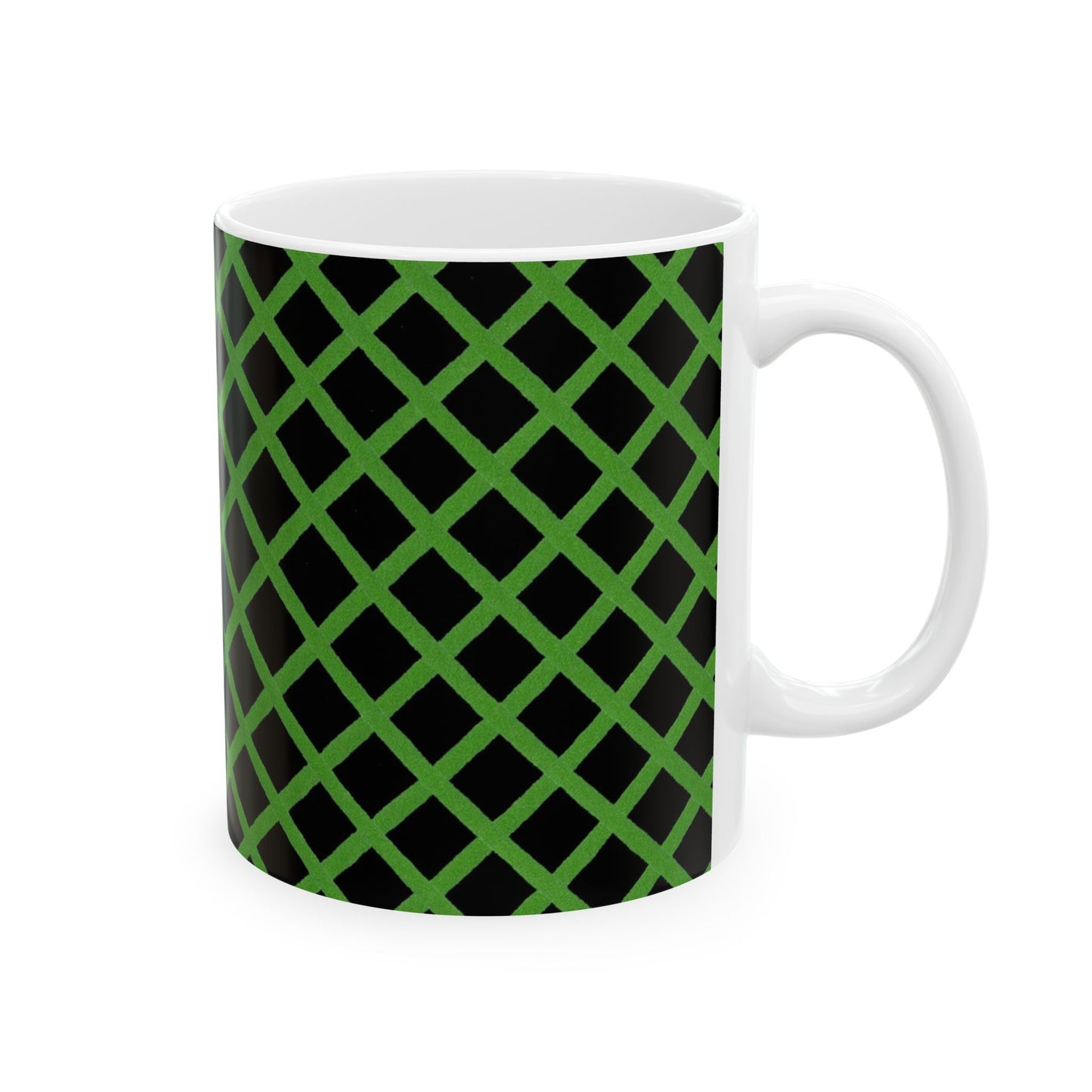 White mug with a green lattice pattern on a black background.