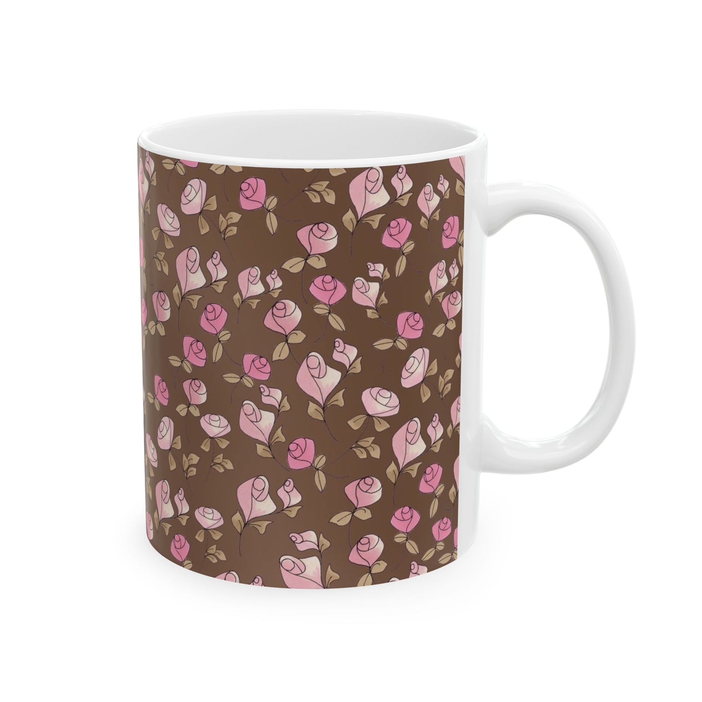 White mug with pink rose pattern on a brown background.