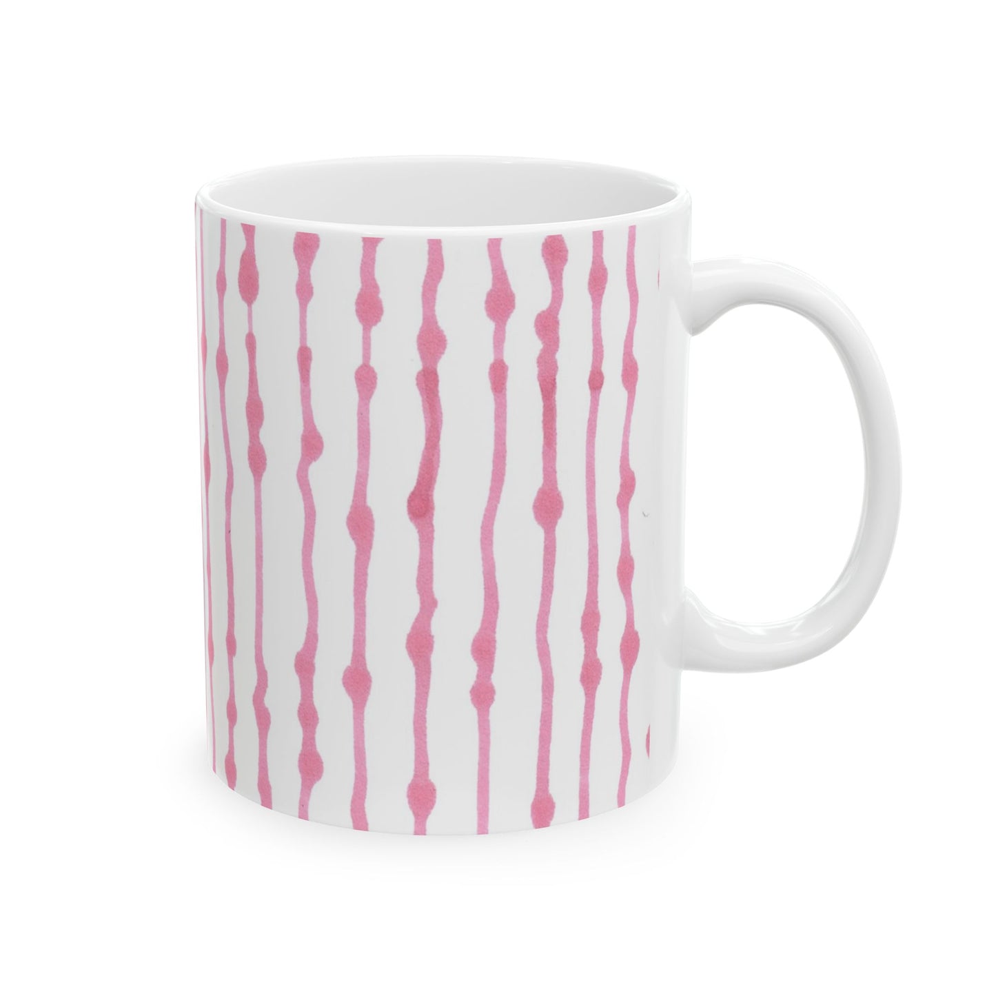 White mug with vertical pink wavy lines and dots pattern.