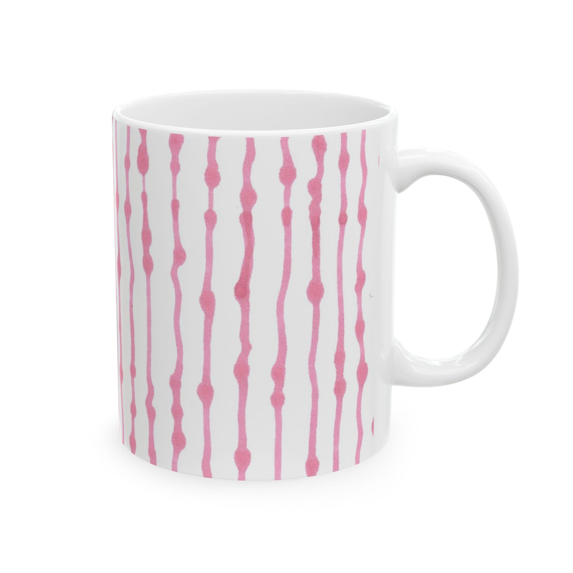 White mug with vertical pink wavy lines and dots pattern.