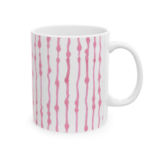 White mug with vertical pink wavy lines and dots pattern.