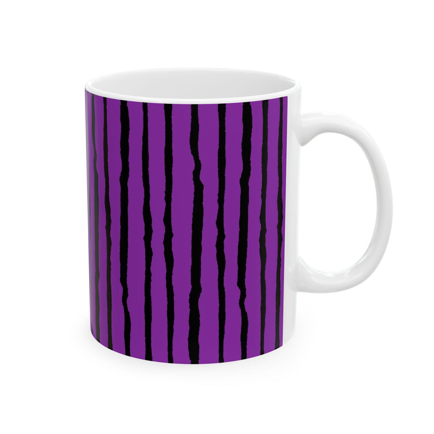White mug with vertical black stripes on a purple background.