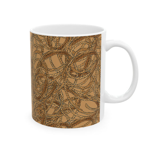 White mug with a brown rope pattern on a tan background, showcasing intricate, intertwined loops.
