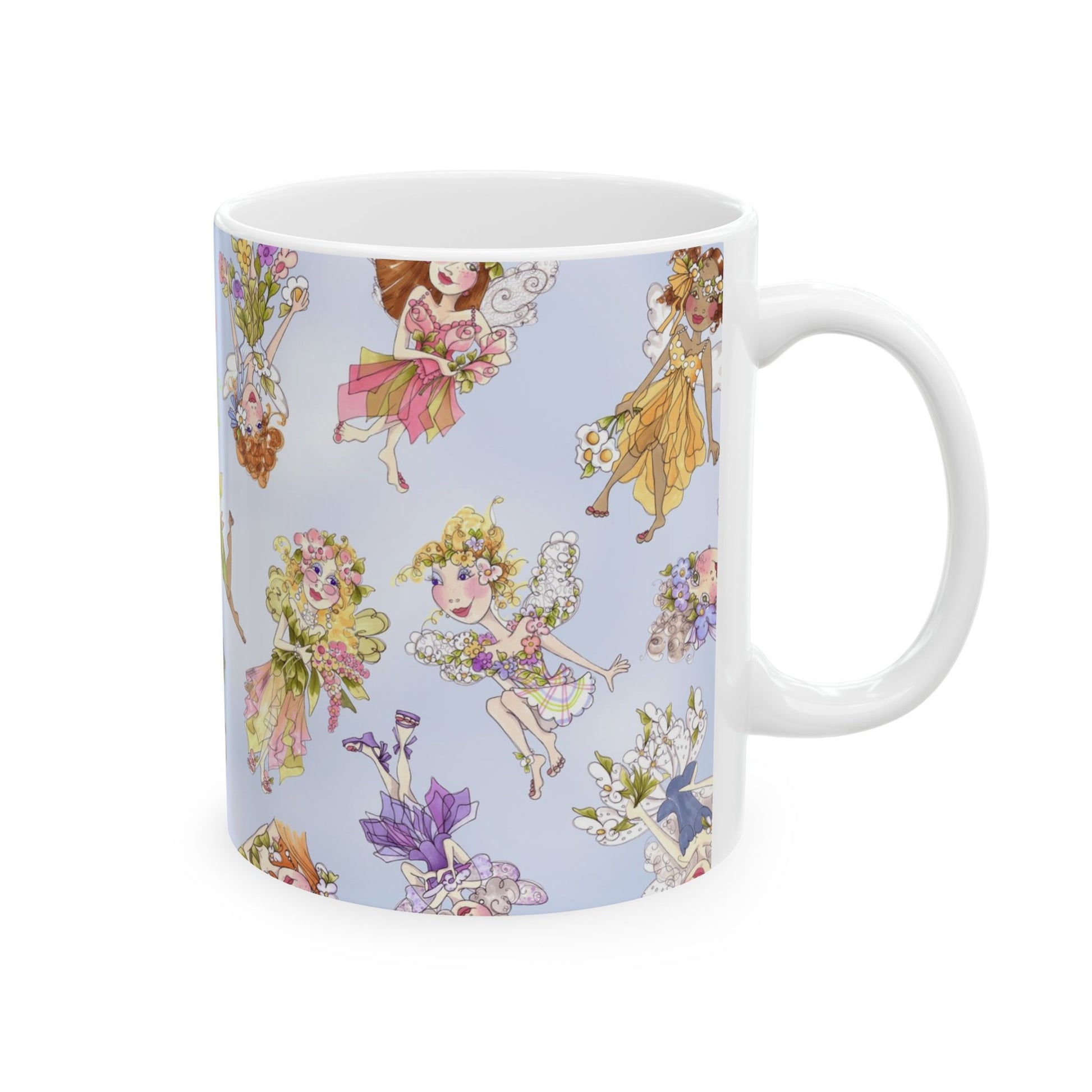 White mug with colorful fairy illustrations on a light blue background.