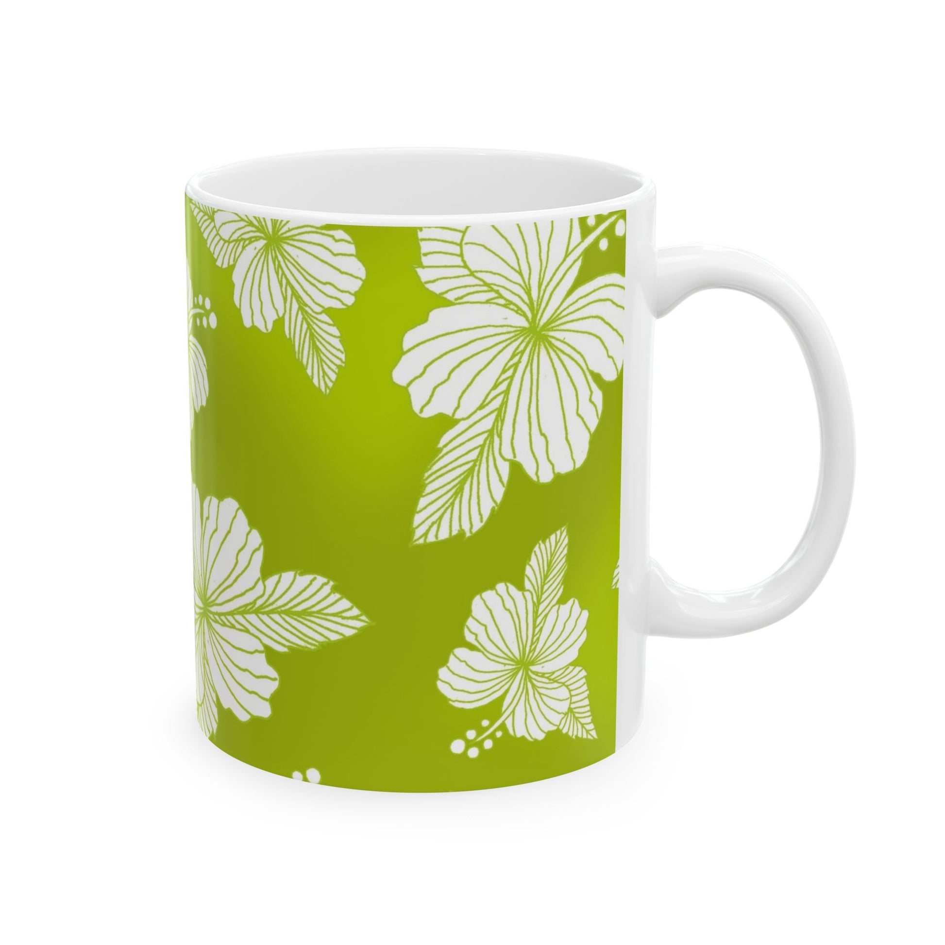 White mug with green background, featuring white hibiscus flower patterns.