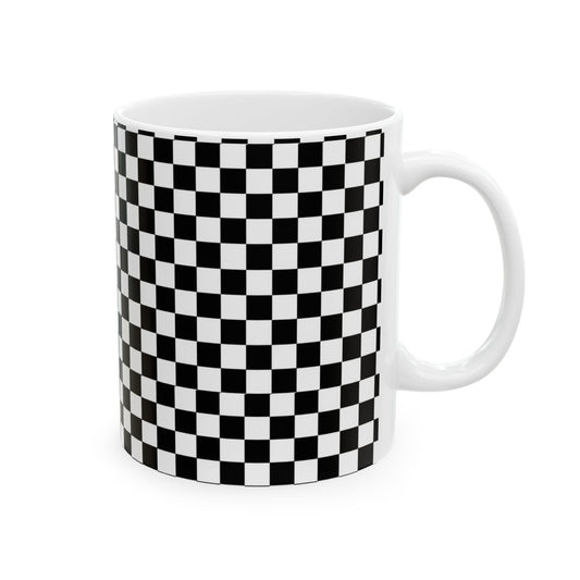 White mug with a black and white checkered pattern covering its surface.