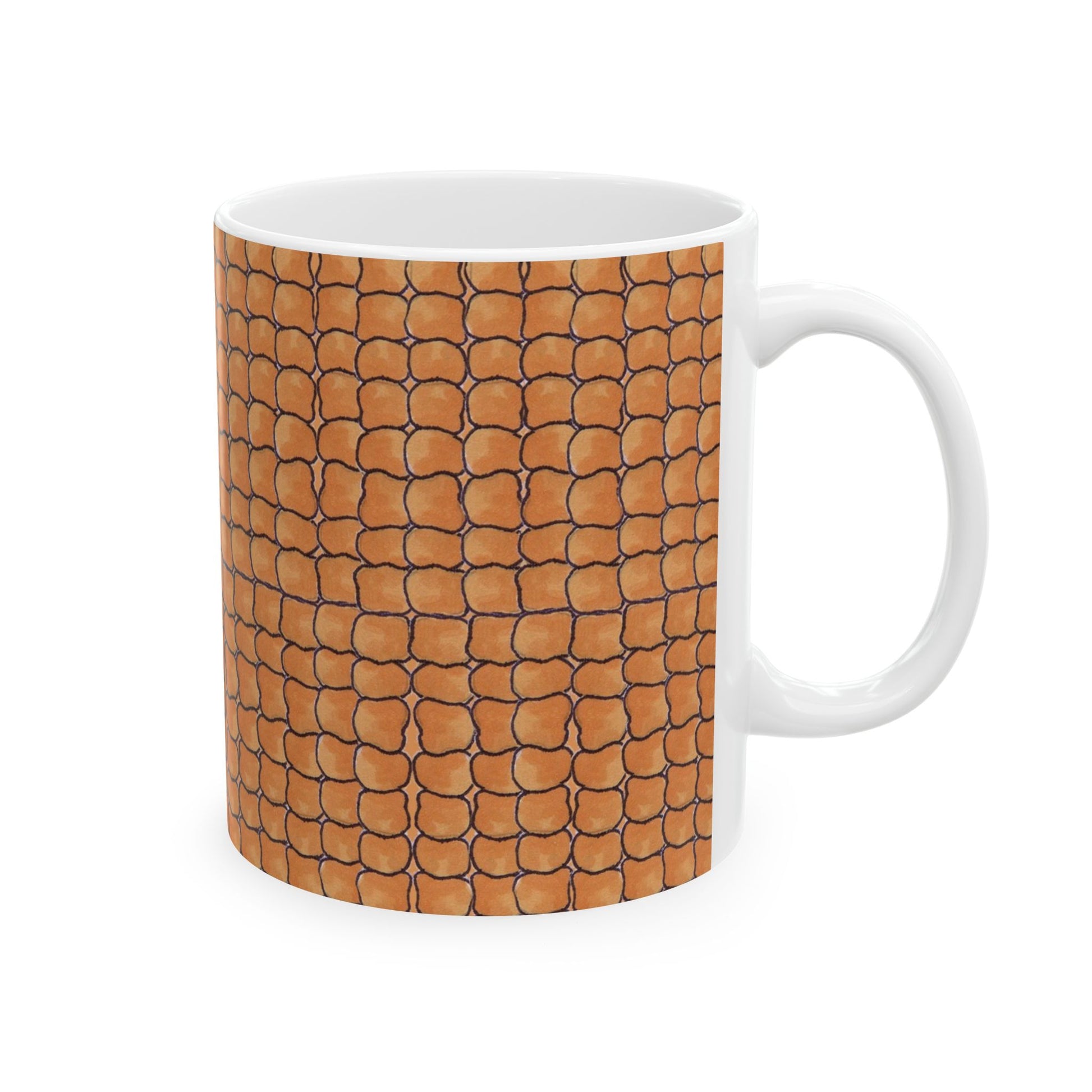 White mug with a pattern of brown, overlapping scales outlined in black.