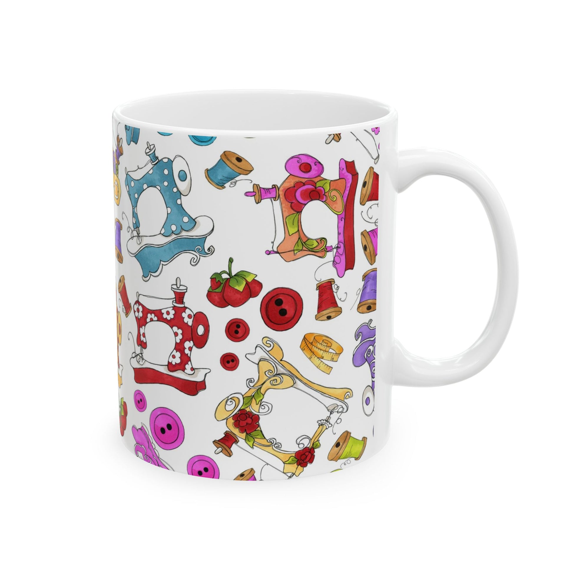 White mug with colorful sewing machine, spool, button, and cherry illustrations.
