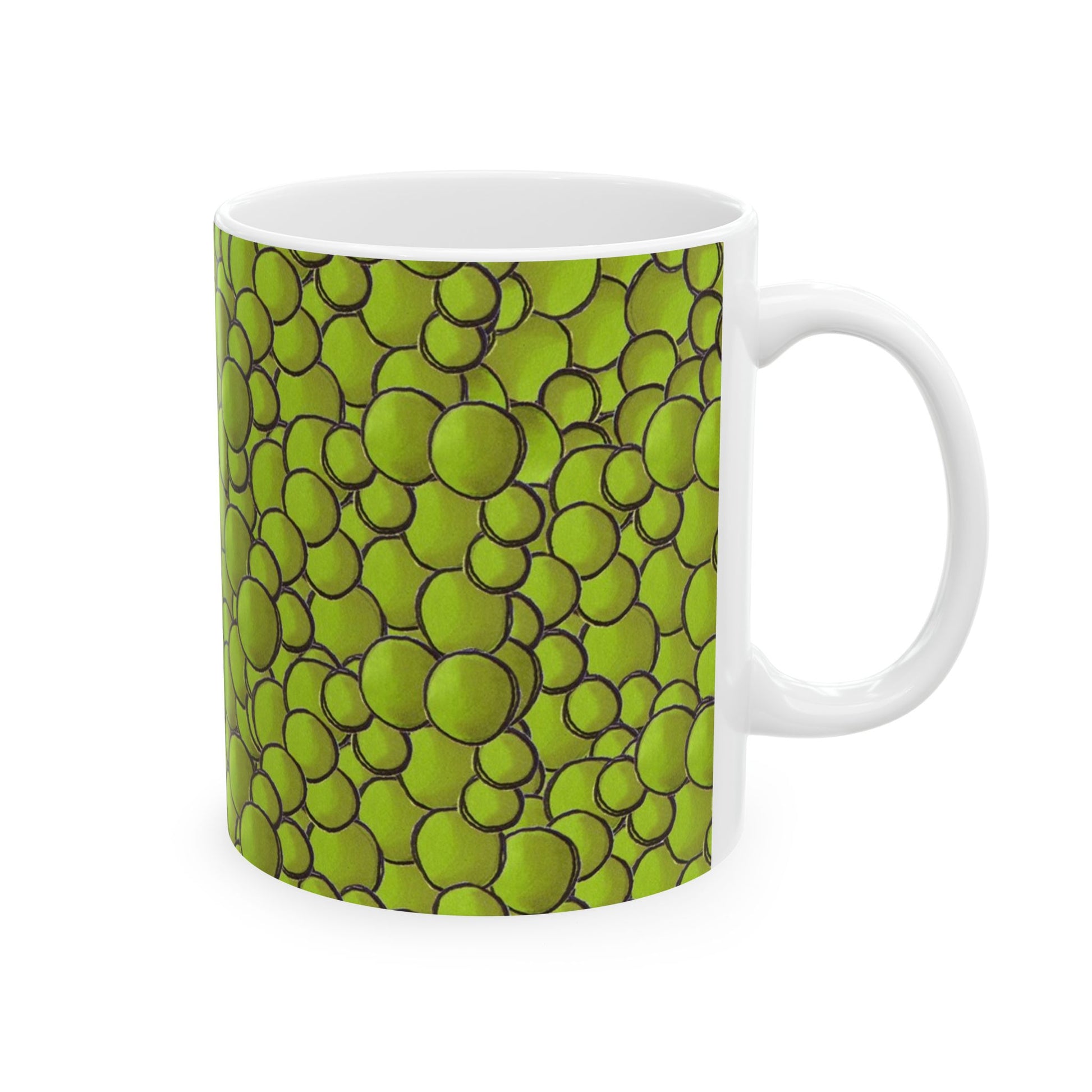 White mug with green bubble pattern, outlined in black.