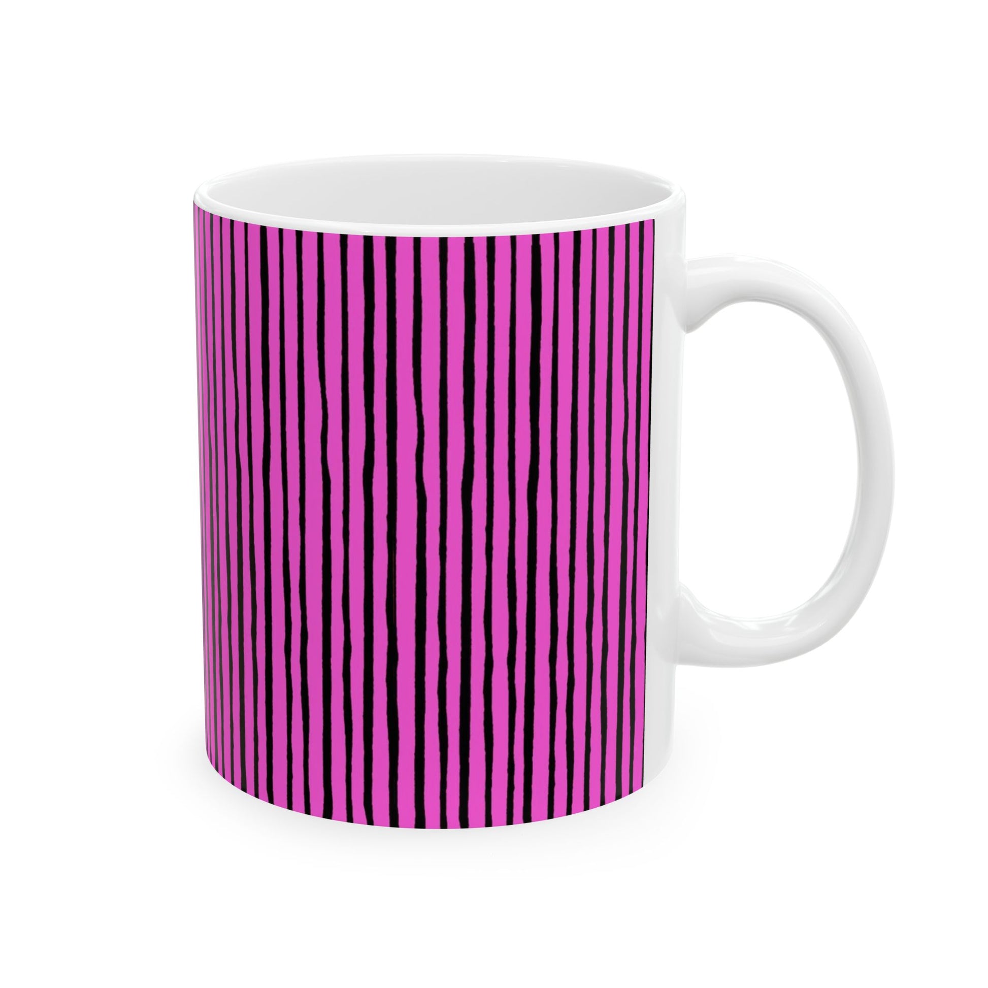 White mug with vertical black lines on a bright pink background.