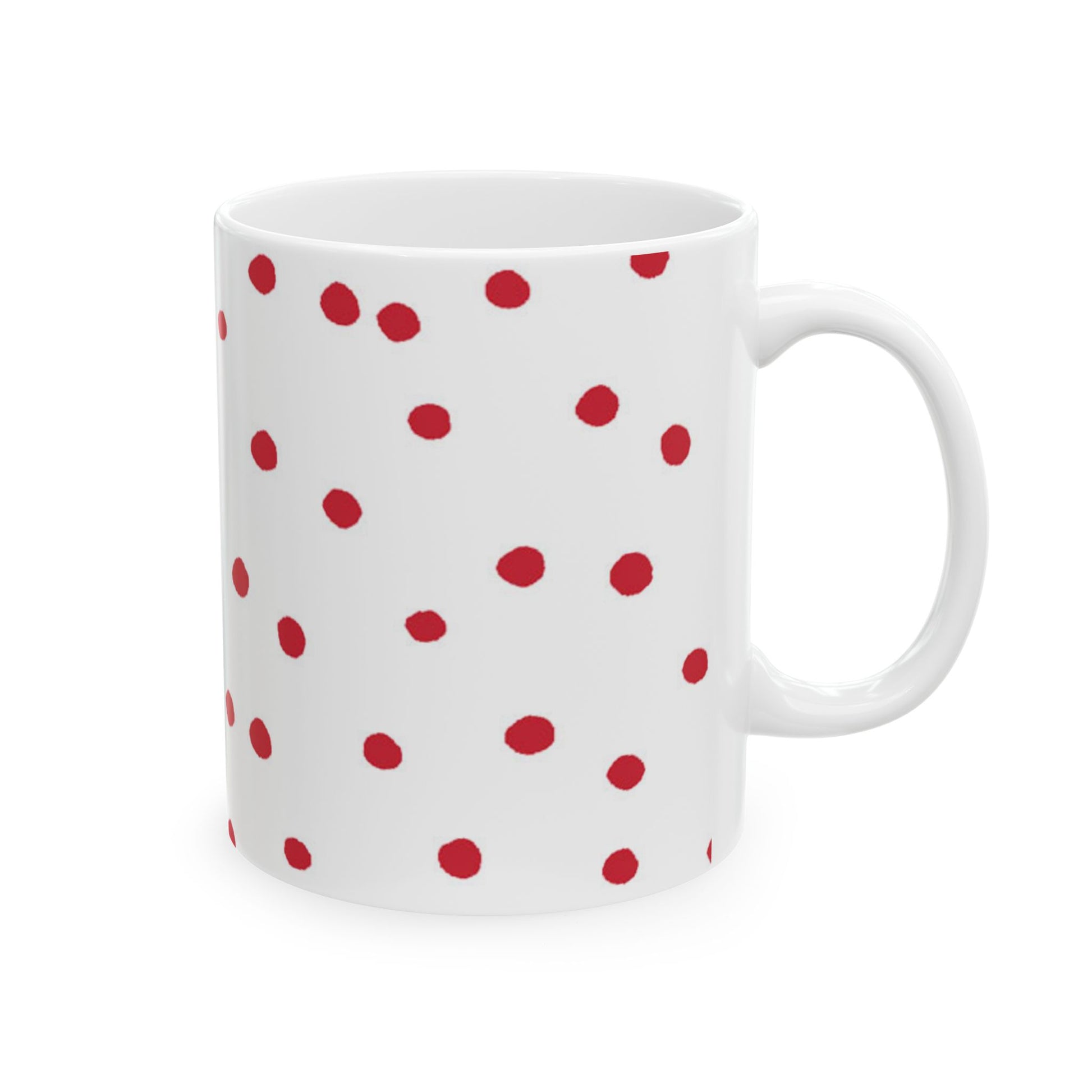 White mug with scattered red polka dots.