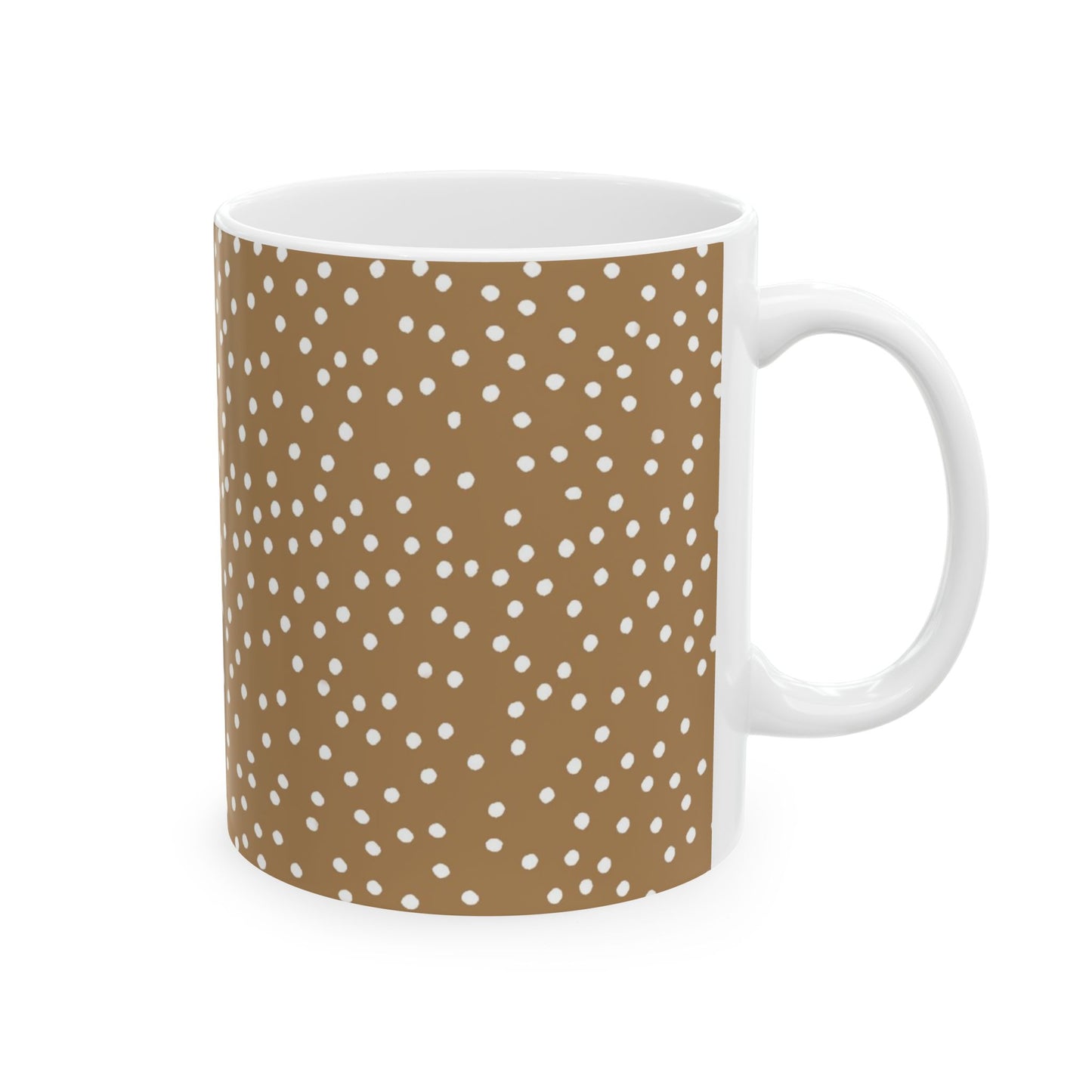 White mug with a brown background and scattered white polka dots covering its surface.