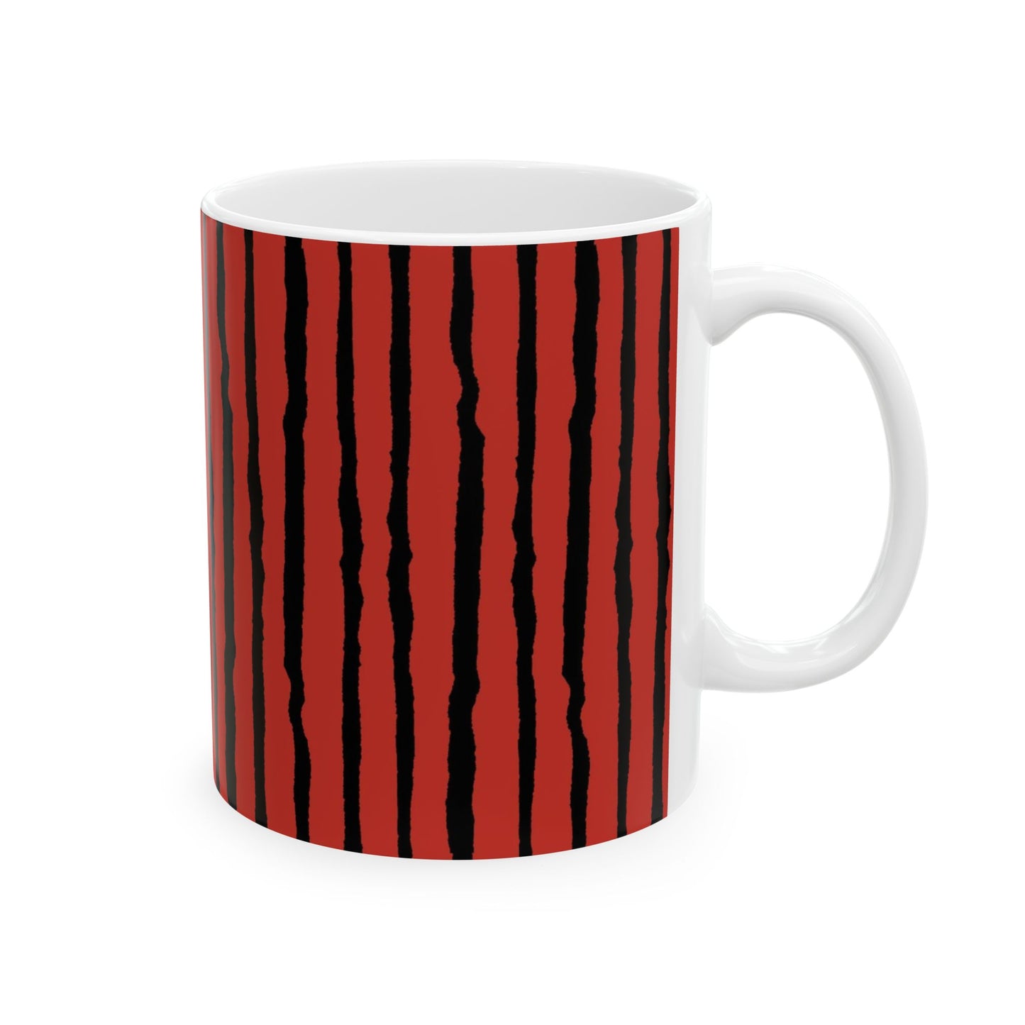 White mug with vertical black wavy stripes on a red background.