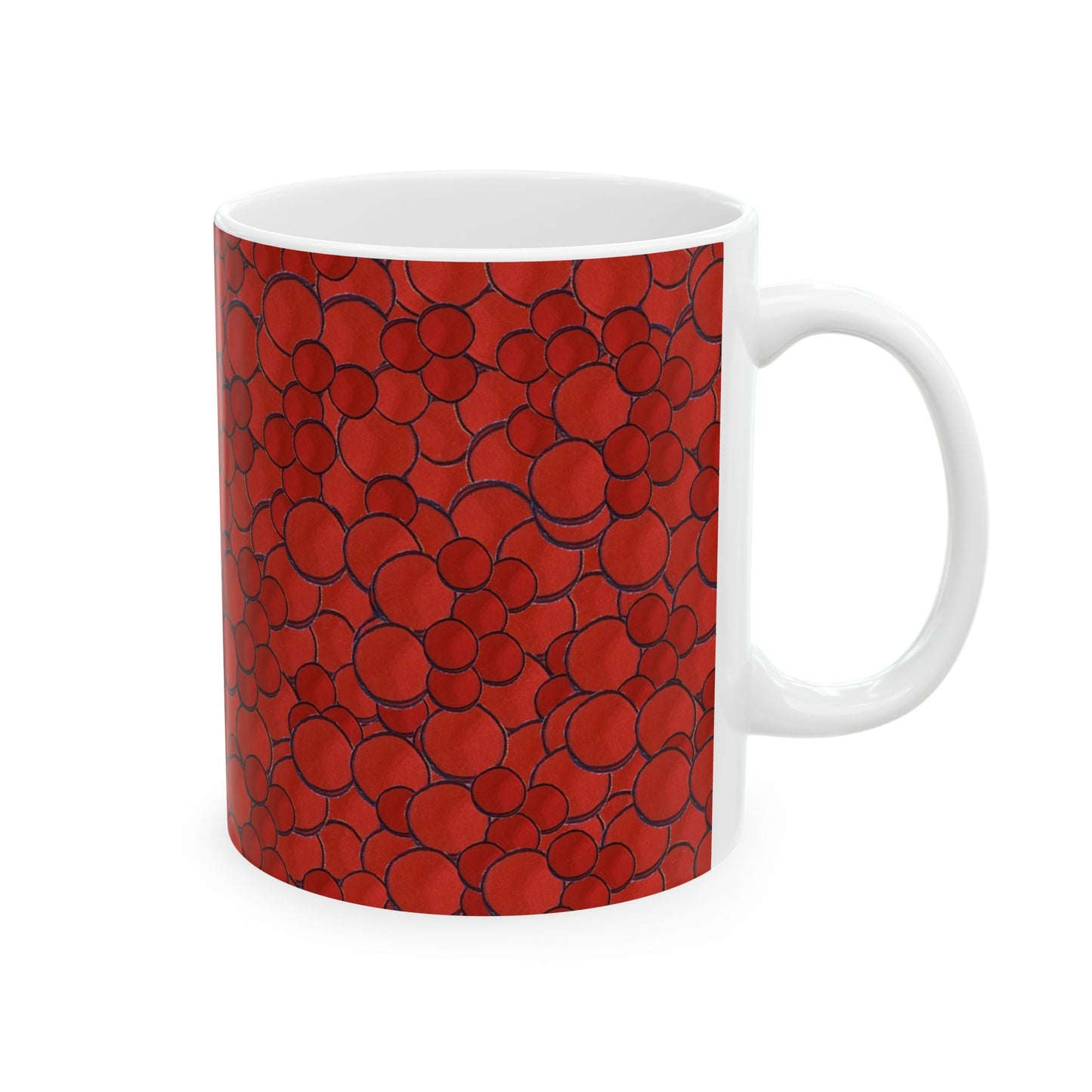 White mug with a red bubble pattern, featuring various overlapping circles outlined in black.
