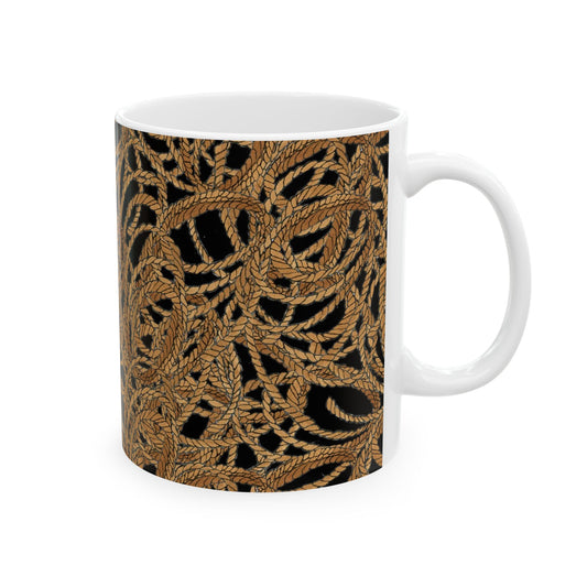 White mug with intricate golden rope pattern on a black background.