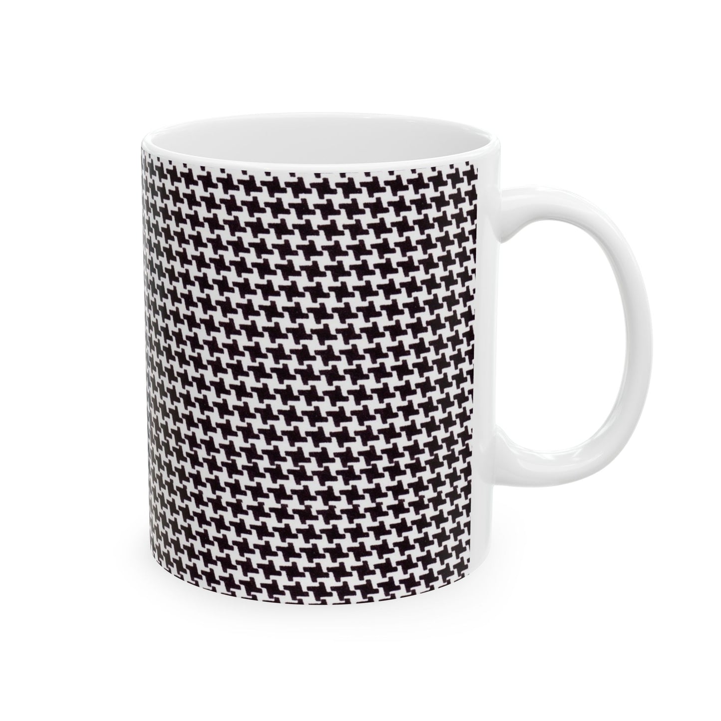 White mug with black and white houndstooth pattern covering its surface.