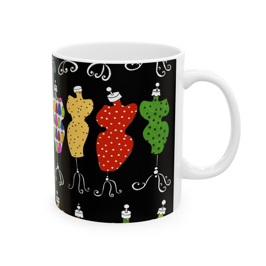 White mug with black background featuring colorful dress forms with polka dots and patterns.