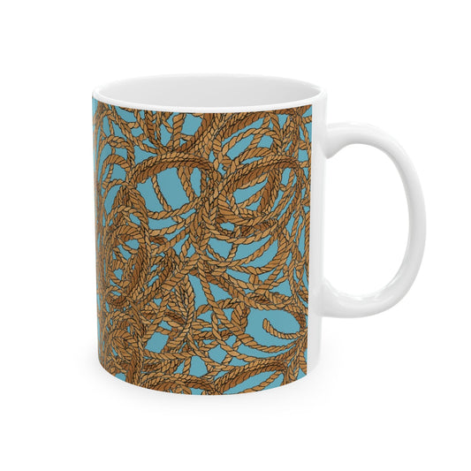 White mug with a blue background and intricate brown rope pattern wrapping around it.