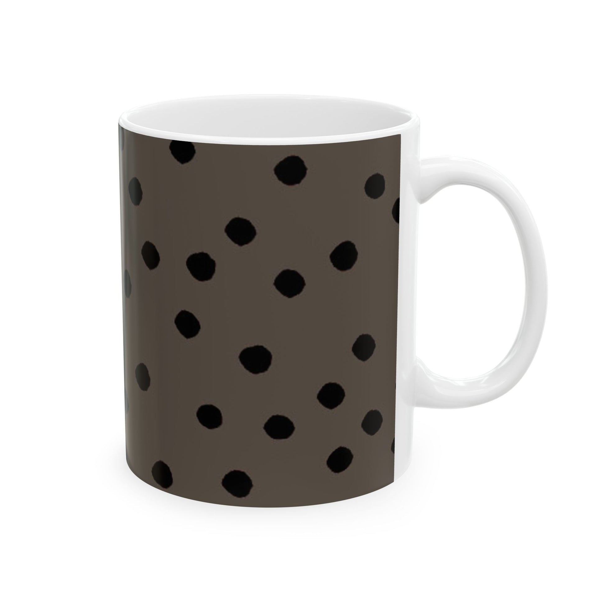 Brown mug with black polka dots, white interior and handle, against a white background.