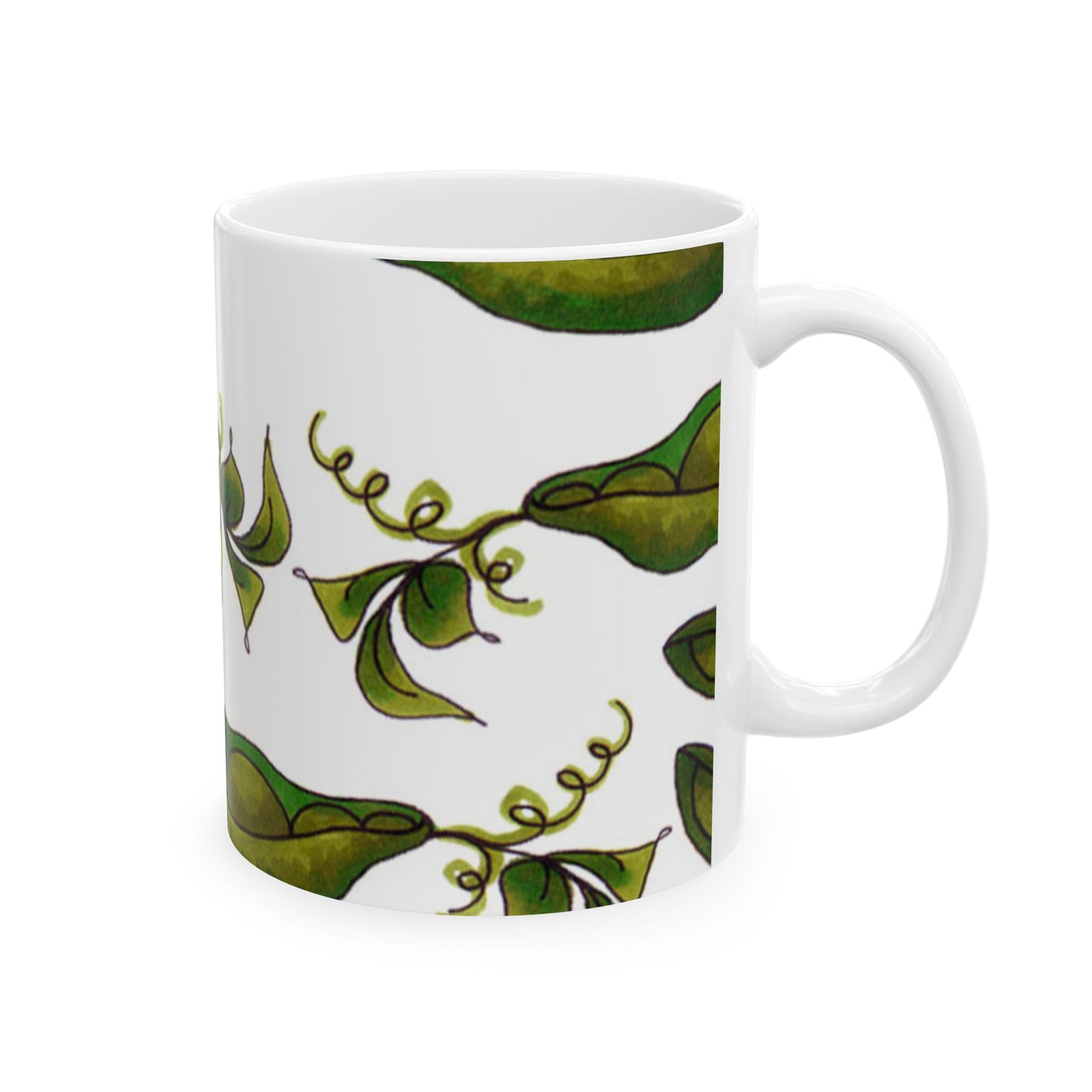 White mug with a pattern of green leaves and swirls on a white background.