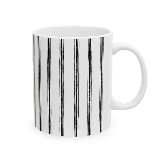 White mug with vertical black stripes and a plain handle on a white background.