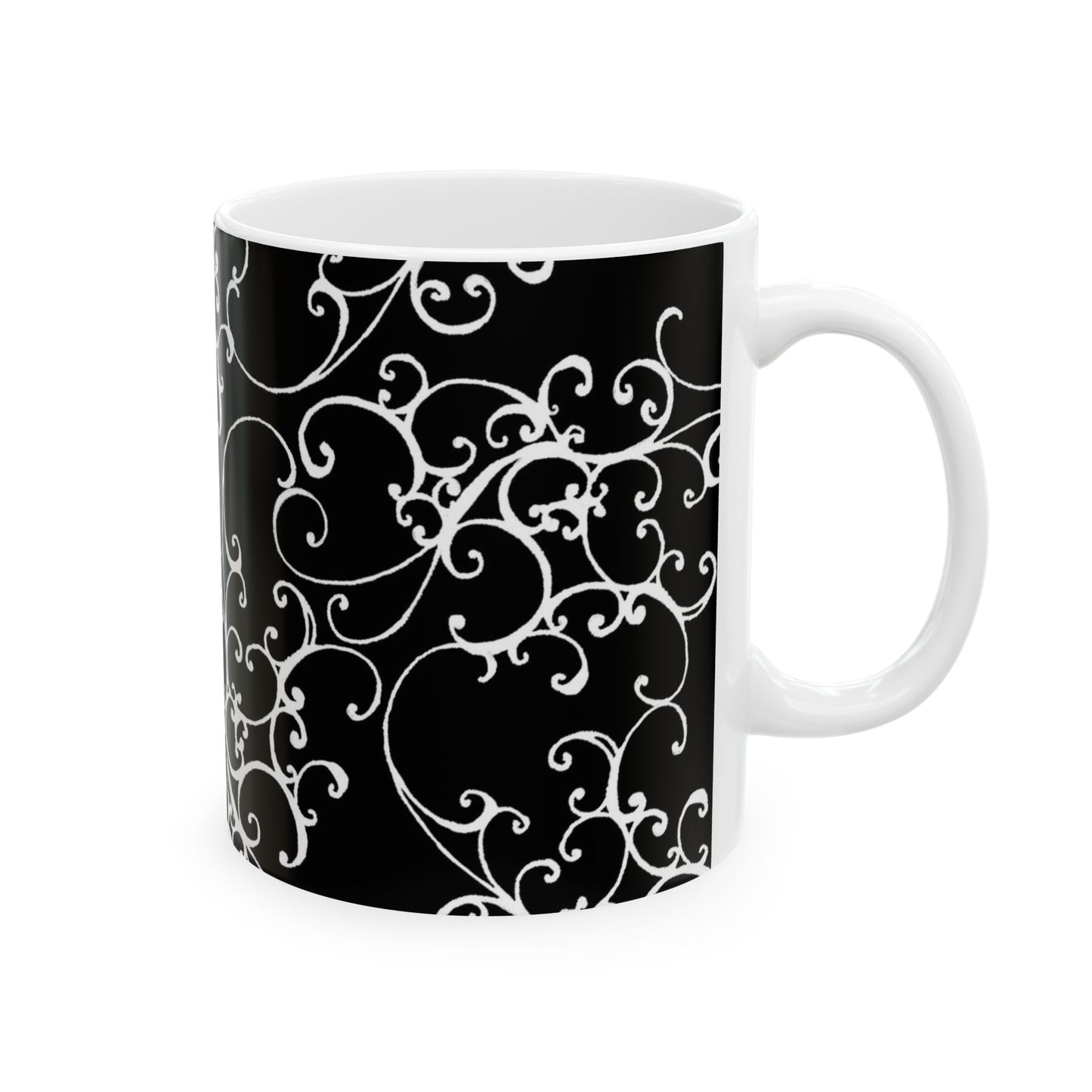 Black mug with intricate white swirling patterns and a plain white interior.