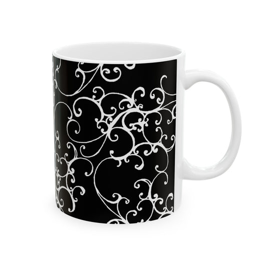 Black mug with intricate white swirling patterns and a plain white interior.