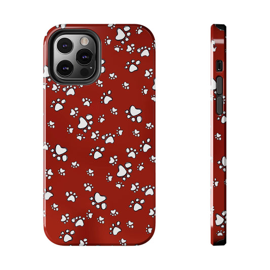 Red phone case with white paw print pattern and three camera cutouts on the back.