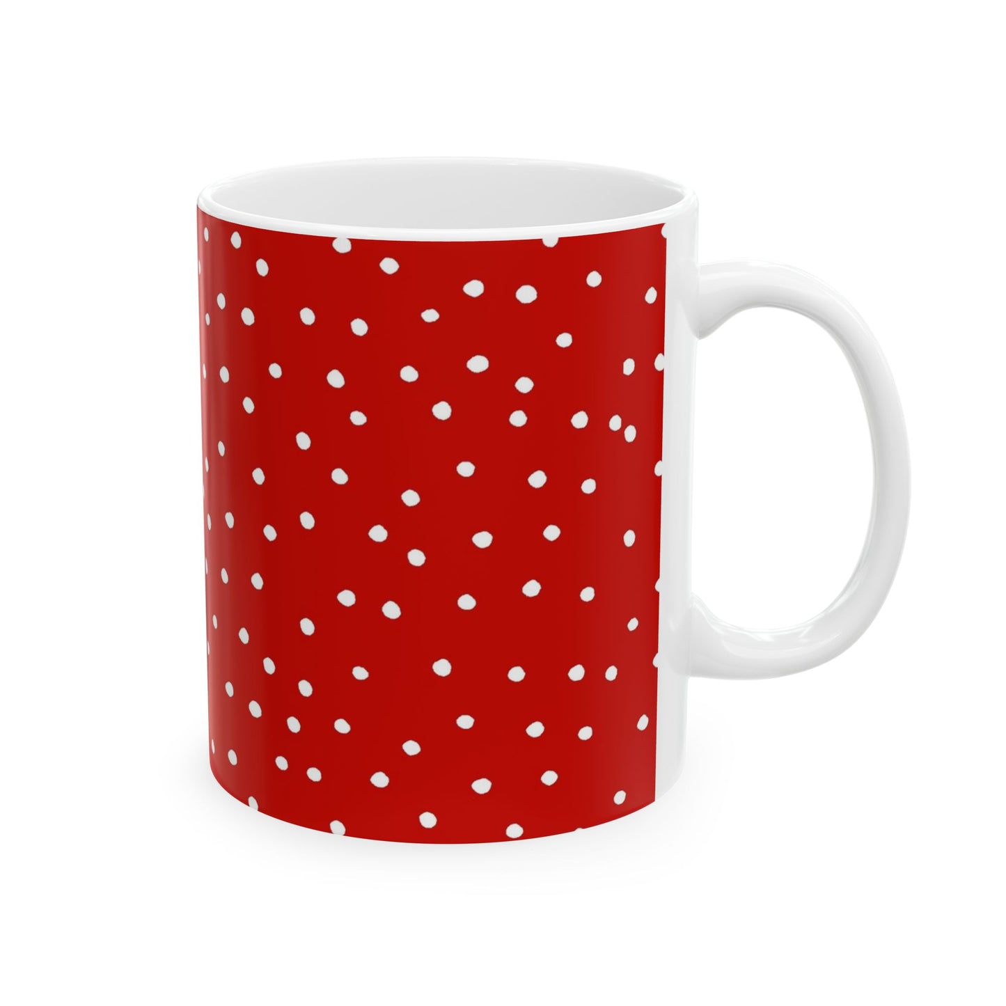 Red mug with white polka dots, white interior and handle.